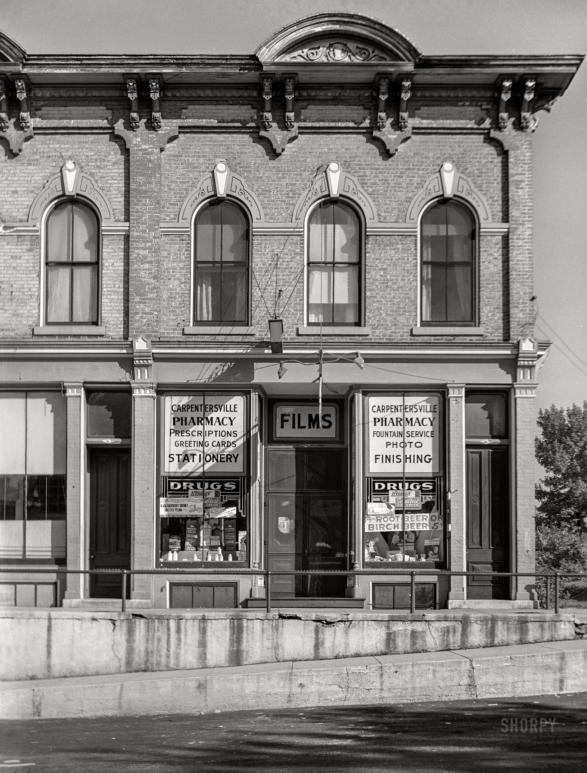 August 1941. "Drug store. Carpentersville, Illinois." Medium format acetate negative by John Vachon for the Farm Security Administration. View full size.