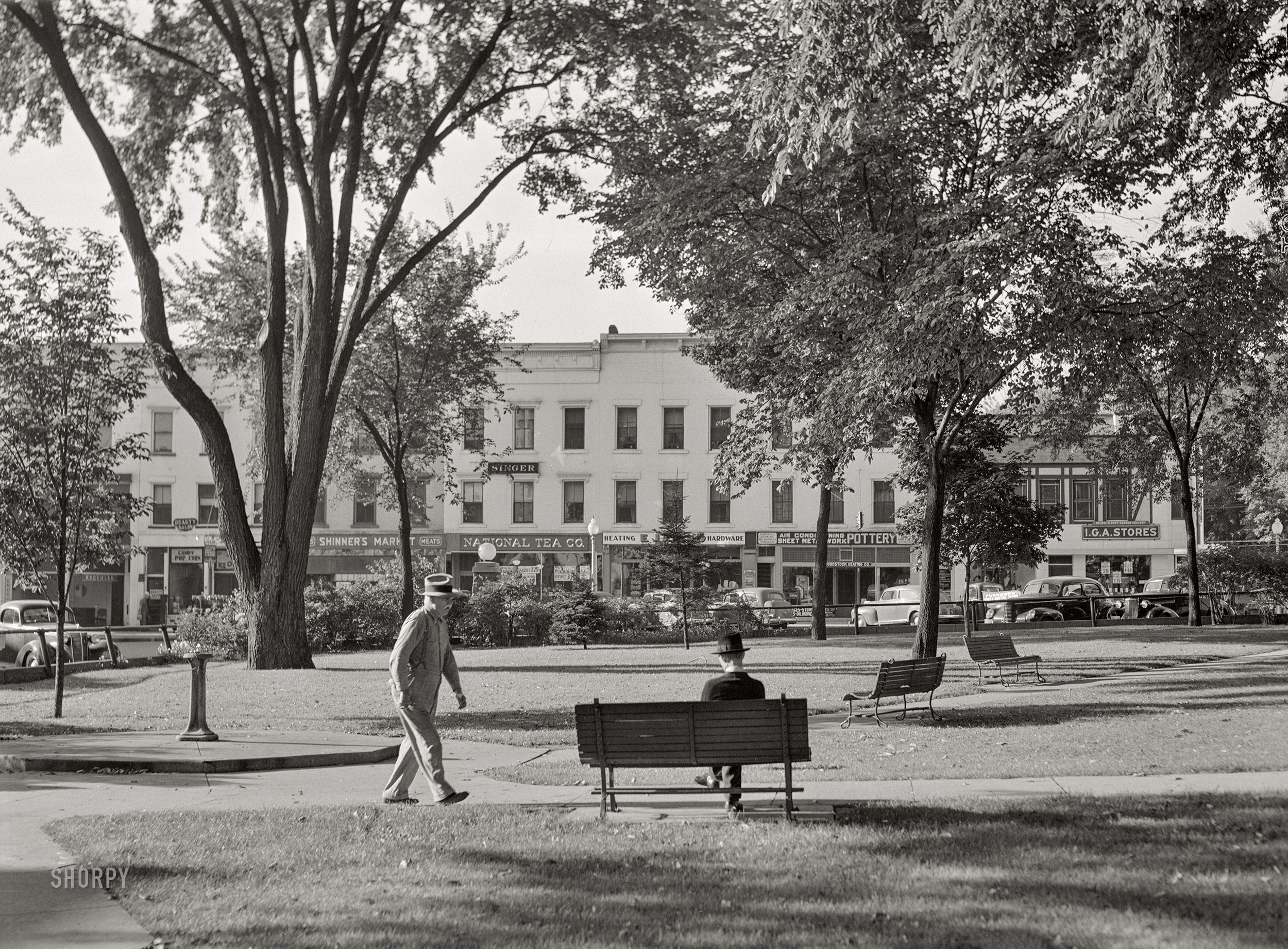 August 1941. "Town square. Woodstock, Illinois." Medium format acetate negative by John Vachon for the Farm Security Administration. View full size.