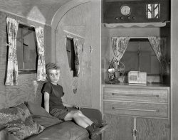 August 1941. "Son of Mr. Nichols, defense worker from Cass City, Michigan, now living in a trailer at Edgewater Park near Ypsilanti. Mr. Nichols works in the Ford bomber plant." Medium format acetate negative by John Vachon for the Farm Security Administration. View full size.