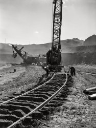 August 1941. "Moving railroad track in the Mahoning pit. Hibbing, Minnesota." Medium format acetate negative by John Vachon for the Farm Security Administration. View full size.