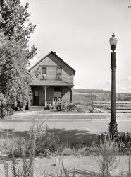 August 1941. "House in North Hibbing, Minnesota, on the edge of the world's largest open pit iron mine. Houses in this section are being demolished daily as mining operations expand." Medium format acetate negative by John Vachon. View full size.