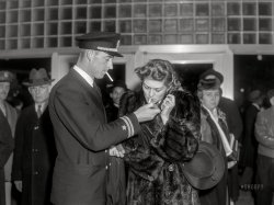 December 24, 1941. Washington, D.C. "Greyhound bus terminal on the day before Christmas. Waiting to board the bus to Richmond." Acetate negative by John Vachon. View full size.