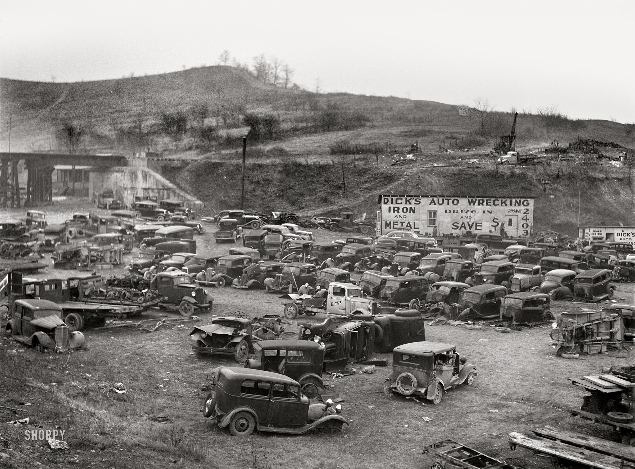 January 1942. "Wrecking yard in Clarksburg, West Virginia." Medium format acetate negative by John Vachon for the Office of War Information. View full size.