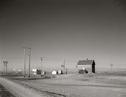 February 1942. "Faulk County, South Dakota. Crossroads." Mobilgas, Standard or Hamm's? Medium format negative by John Vachon for the Office of War Information. View full size.