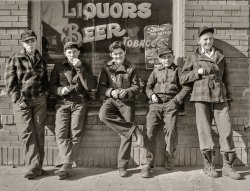 February 1942. "Roscoe, South Dakota. Younger boys are standing in front of the pool halls this year." Acetate negative by John Vachon for the Office of War Information. View full size.