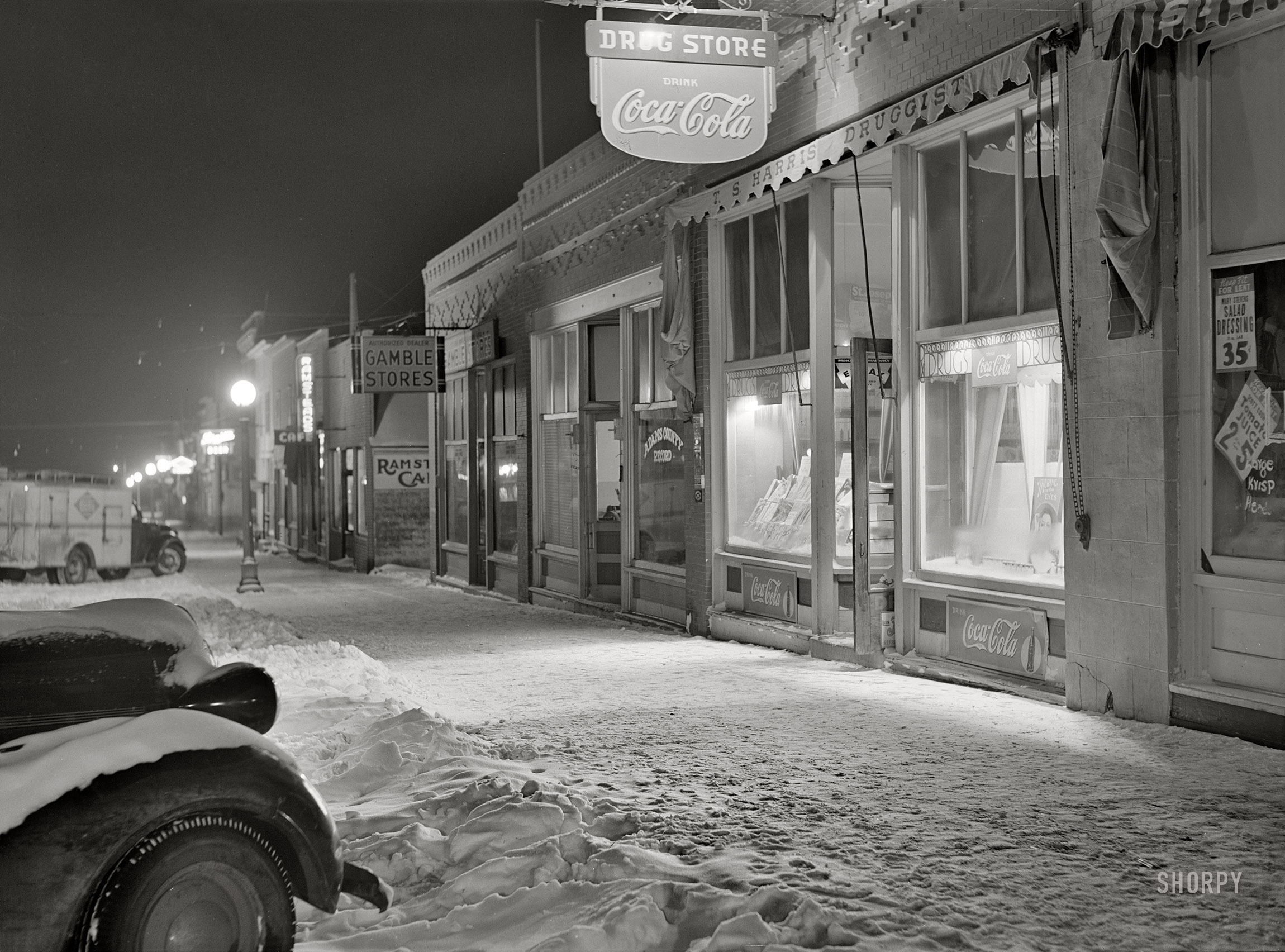February 1942. "Hettinger, North Dakota. Street scene after a snowstorm." Medium format acetate negative by John Vachon for the Office of War Information. View full size.