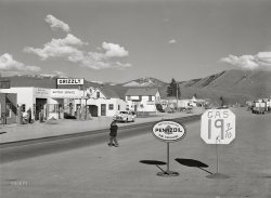 April 1942. "Missoula, Montana. Entering the town." Grizz vs. Pennz at fifty paces. Medium format acetate negative by John Vachon for the Office of War Information. View full size.