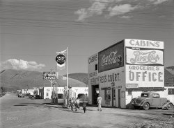 April 1942. "Missoula, Montana. Entering the town. Tourist apartments." More specifically, the "Strictly Modern" Beauty Ress Court. And gas station. With your choice of Coke, Pepsi or Calso. Acetate negative by John Vachon for the Farm Security Administration. View full size.