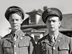 May 1942. Kremmling, Colorado. "Soldiers from Fort Logan hitchhiking along U.S. Highway 40." Acetate negative by John Vachon for the Farm Security Administration. View full size.