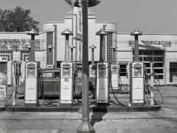 May 1942. "North Platte, Nebraska. Gas station." Flavors on tap from this ten-pump petro-pub include Distillate, Mobilgas, Diesel Fuel, Kerosene, Hi-Lite, Ethyl and Metro. Medium format acetate negative by John Vachon for the Farm Security Administration. View full size.