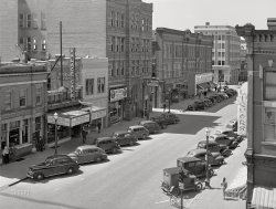 May 1942. "Grand Island, Nebraska." Home of the "homey" Palace Cafe. Medium format acetate negative by John Vachon for the Farm Security Administration. View full size.