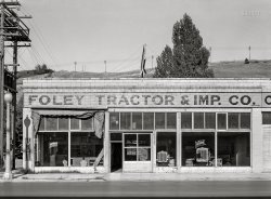July 1941. "Washington wheat country. Farm machinery for sale and repair shop in Colfax, Washington." Photo by Russell Lee for the Farm Security Administration. View full size.