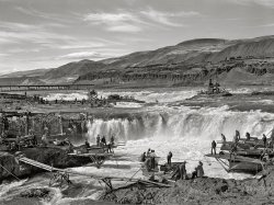 September 1941. "Indians fishing for salmon at Celilo Falls, Oregon. At the present time Indians have by treaty exclusive right for fishing in Columbia River, which is adjacent to their reservation. This right is now being contested in lawsuits." Medium format acetate negative by Russell Lee for the Farm Security Administration. View full size.
