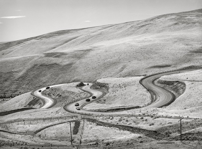 September 1941. "Highway leading down to the gorge at the Columbia River from the bench land. Klickitat County, Washington." Acetate negative by Russell Lee for the FSA. View full size.
