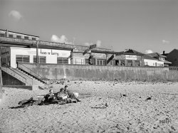September 1941. "Sunbath on the beach. Seaside, Oregon." Enjoying "the panorama of the beach." Acetate negative by Russell Lee for the Farm Security Administration. View full size.