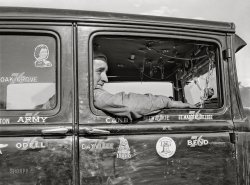 November 1941. "Migrant agricultural worker in his automobile. Wilder, Idaho." Medium format acetate negative by Russell Lee for the Farm Security Administration. View full size.