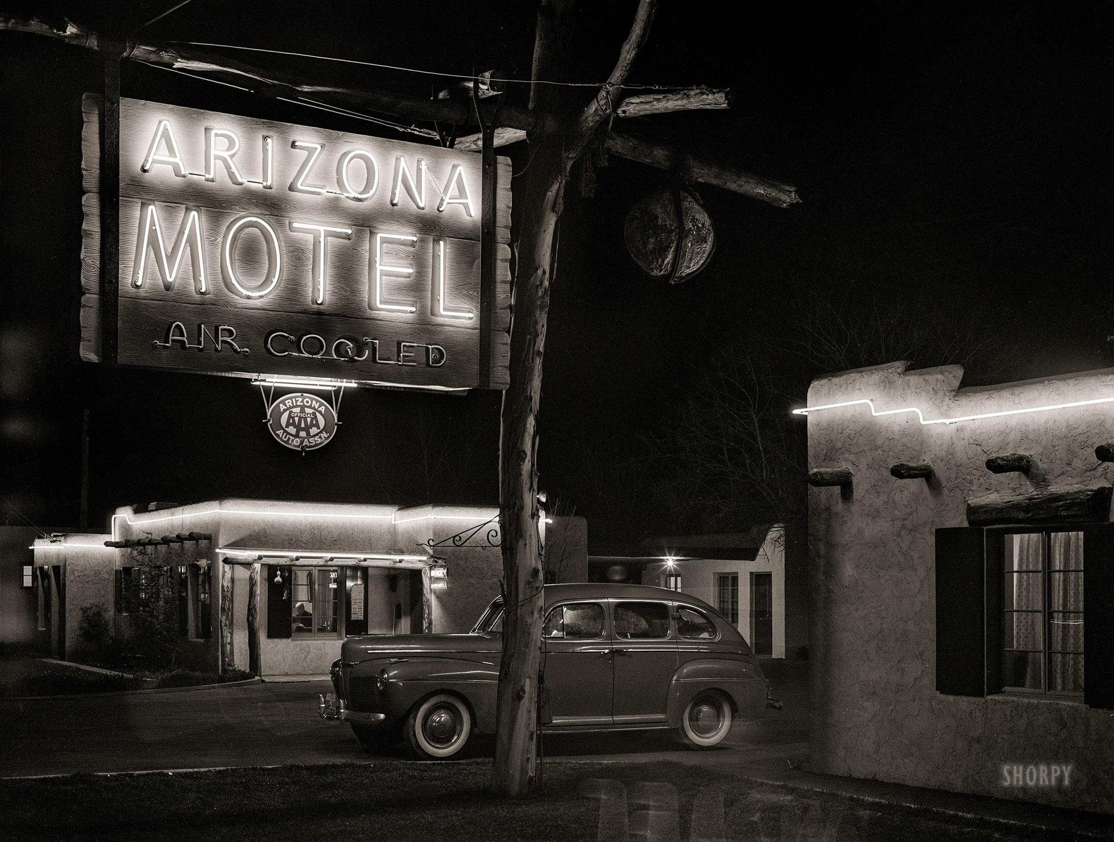 February 1942. "Tourist court. Phoenix, Arizona." An early example of Desert Neon Noir. Medium format negative by Russell Lee for the Farm Security Administration. View full size.