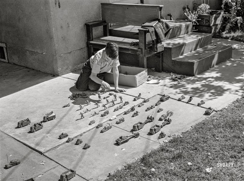 May 1942. "Turlock, California. Son of family in the upper middle income group. War games are popular with the boys." Photo by Russell Lee, Office of War Information. View full size.
