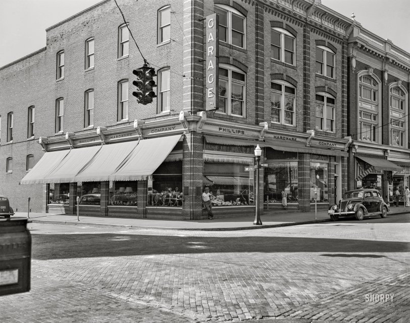 August 1941. "Cambridge, Maryland, home of Phillips Packing Co. tomato canning plant." As well as Phillips Hardware at the corner of Muir and Race streets, and a green-on-top stoplight. 4x5 inch acetate negative by John Collier for the Farm Security Administration. View full size.