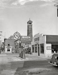 August 1941. Cambridge, Dorchester County, Maryland. "Service station on Gay Street." Acetate negative by John Collier for the Farm Security Administration. View full size.