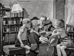 October 1941. "Williamstown, Massachusetts. Father reading to his children." Medium format acetate negative by John Collier for the Farm Security Administration. View full size.