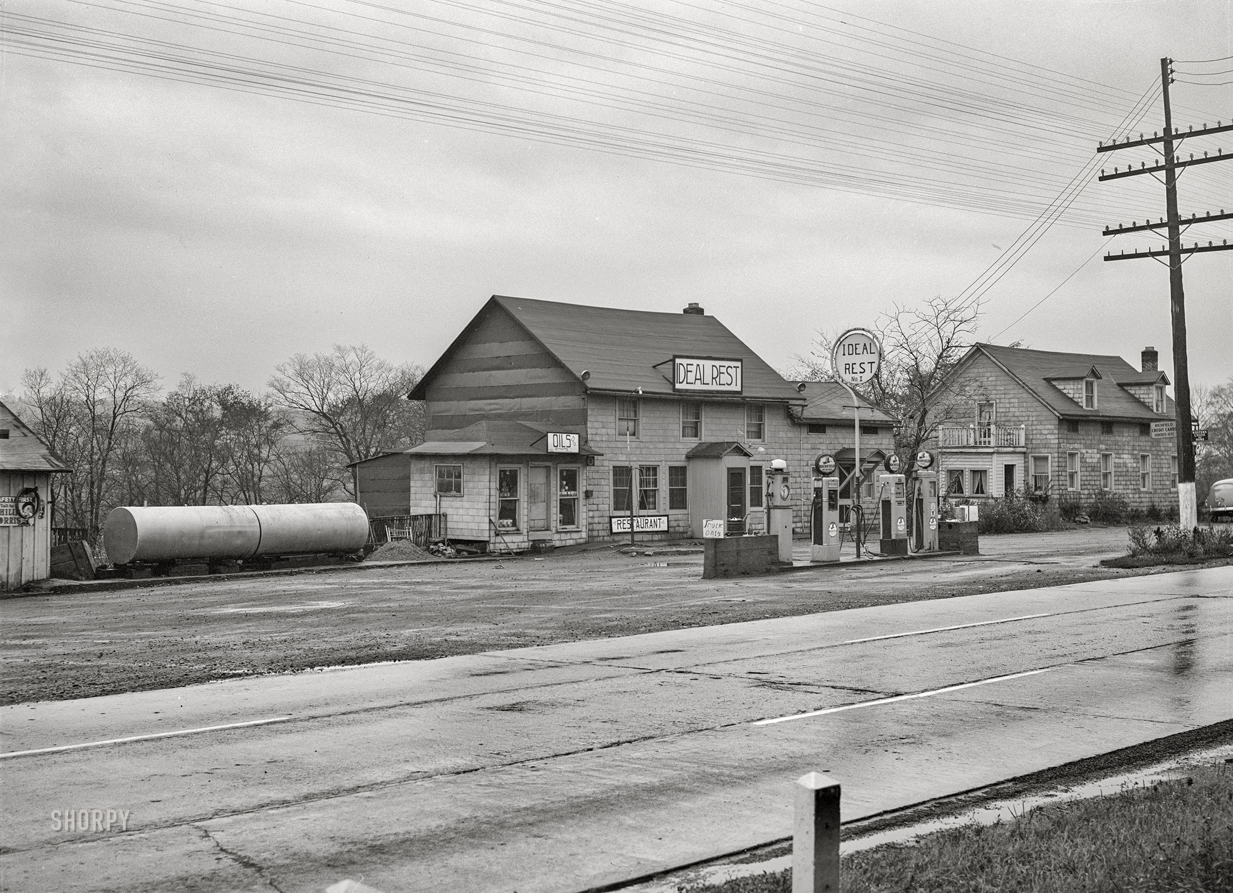 October 1941. "Little Falls, New York (vicinity). Truckers' service station." Medium format acetate negative by John Collier for the Farm Security Administration. View full size.