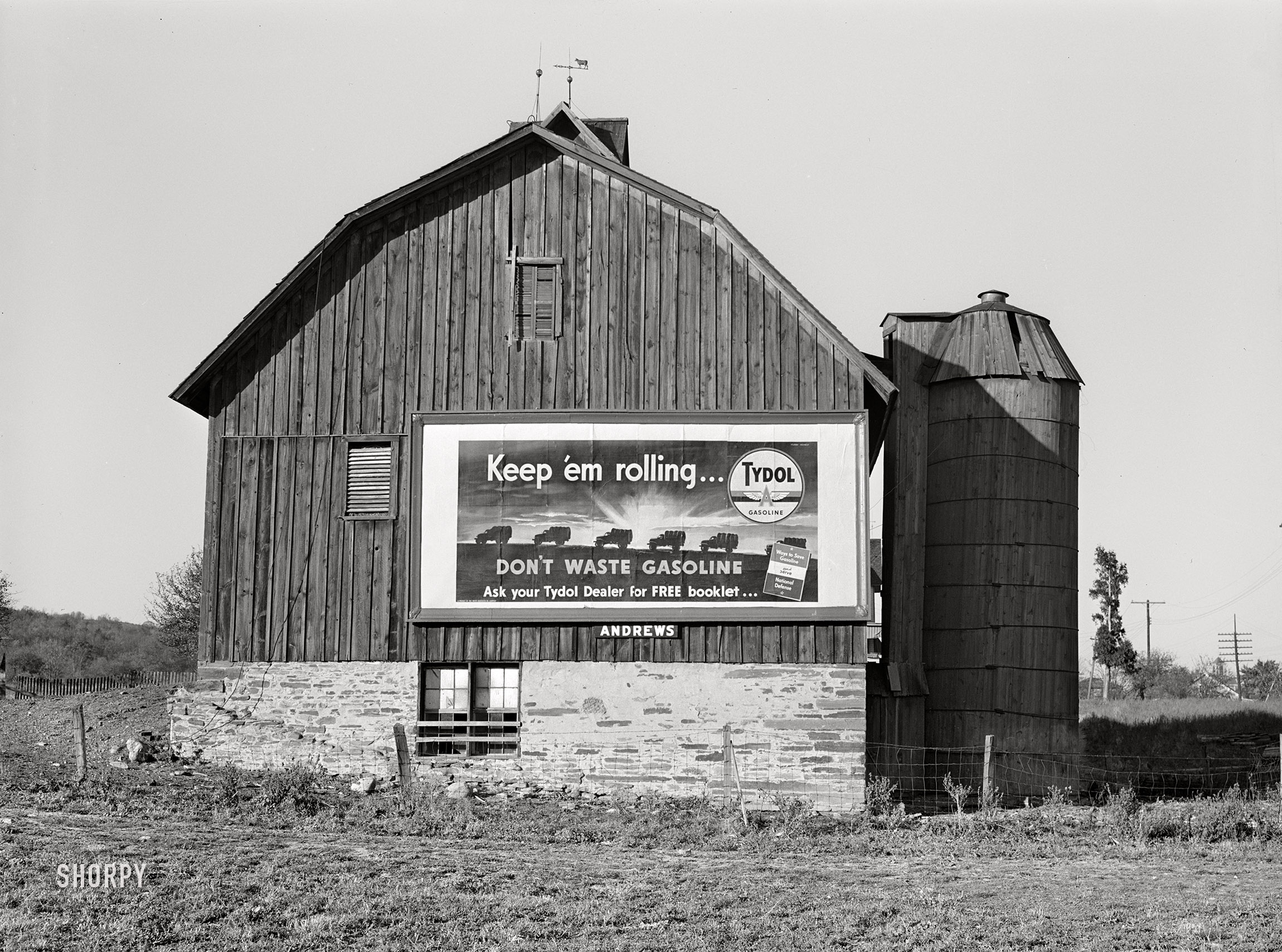 October 1941. "Defense motive in outdoor advertising. Near Elmira, New York." Medium format acetate negative by John Collier for the Farm Security Administration. View full size.