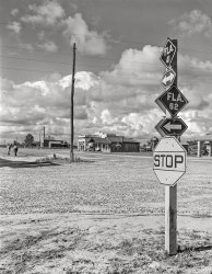 June 1942. "Baker, Florida. Crossroads in nearest town to Escambia Farms." Acetate negative by John Collier for the Farm Security Adminisration. View full size.