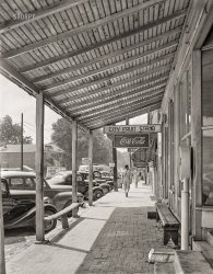 May 1942. "Childersburg, Alabama. Street scene." Medium format acetate negative by John Collier for the Farm Security Administration. View full size.