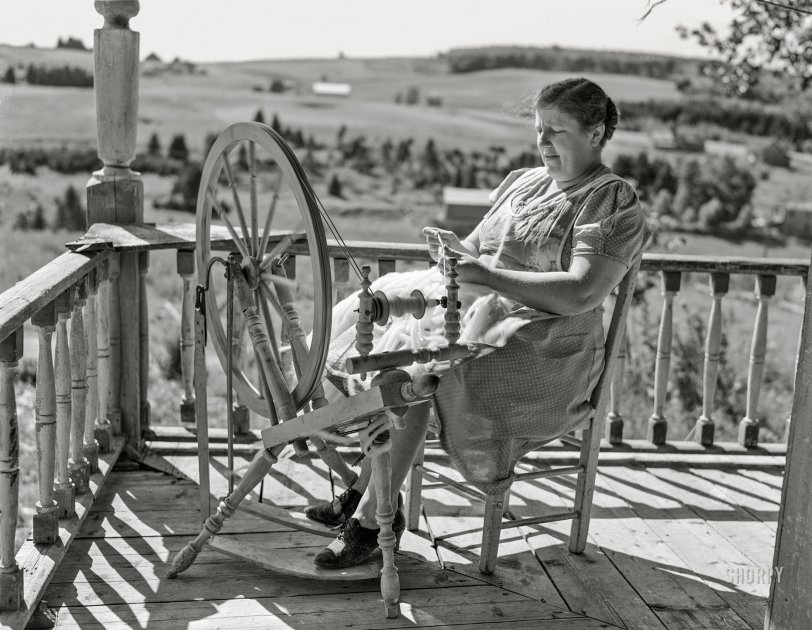 August 1942. "Fort Kent, Maine (vicinity). FSA clients of French descent on the Maine-Canadian border. Wife of Leonard Gagnon, Acadian FSA client, spinning domestic wool for knitting." 4x5 inch acetate negative by John Collier for the Farm Security Administration. View full size.