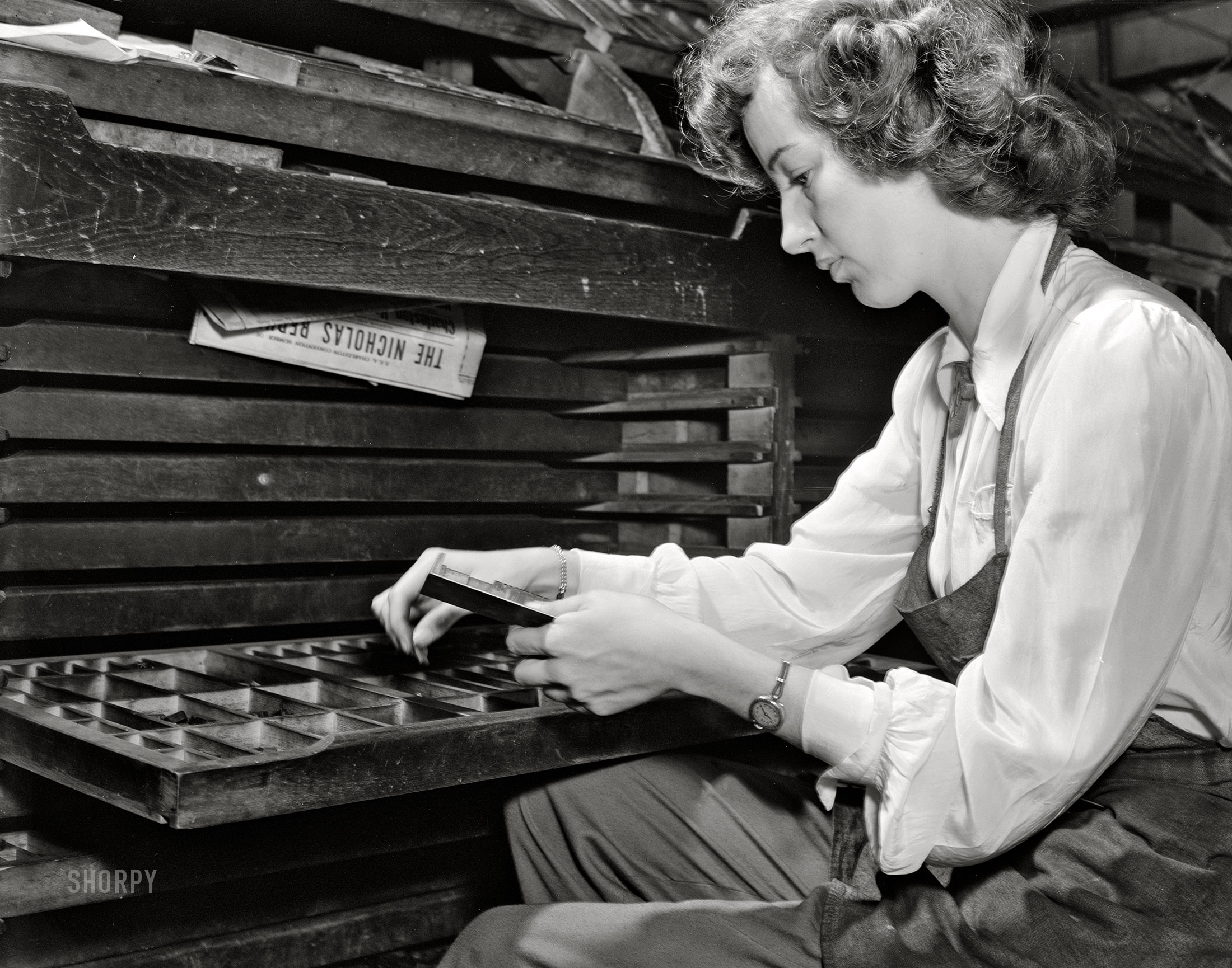 September 1942. Richwood, West Virginia. "Lois Thompson, printer's devil on the Nicholas Republican newspaper." Photo by John Collier, Farm Security Administration. View full size.
