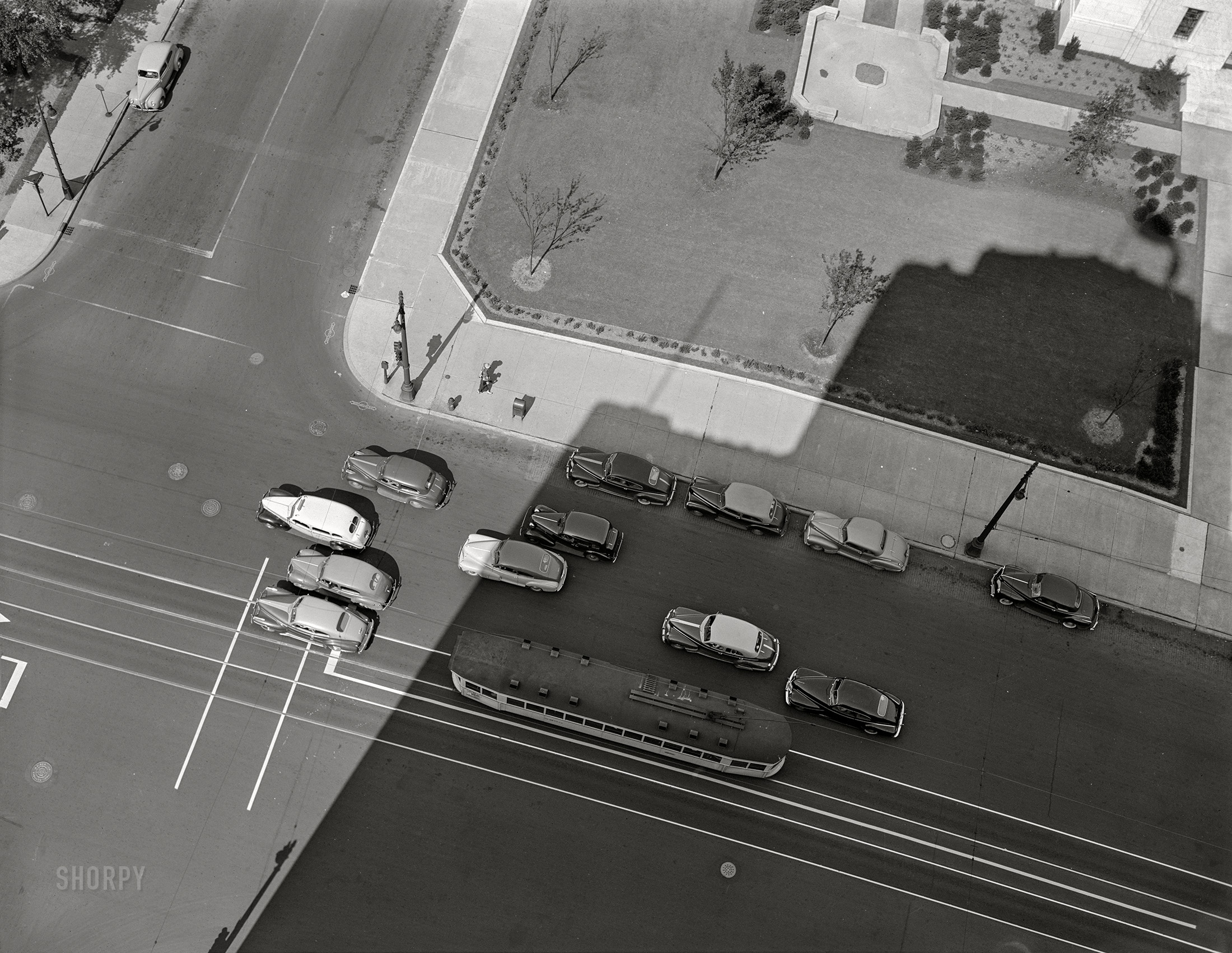 July 1942. Detroit, Michigan. "Street scenes in the downtown business section. Cars waiting for a traffic light on a street with traffic markings." More specifically, Woodward Avenue at Farnsworth Street as seen from the Maccabees Building. 4x5 inch acetate negative by Arthur Siegel for the Farm Security Administration. View full size.