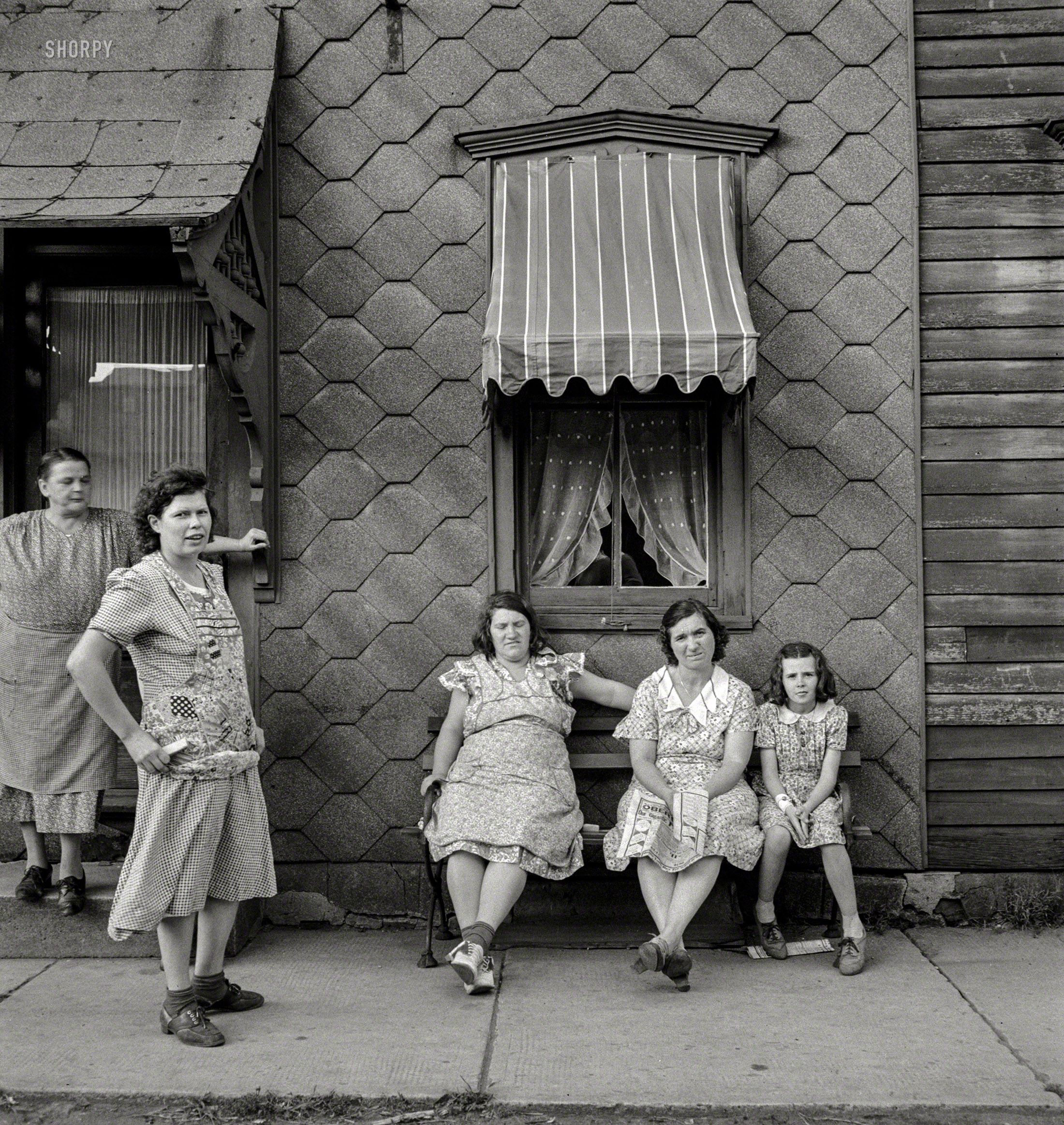 August 1940. "Women in Upper Mauch Chunk, Pennsylvania." Medium-format negative by Jack Delano for the Resettlement Administration. View full size.
&nbsp; &nbsp; &nbsp; &nbsp; Mauch Chunk, a town whose name was "derived from the term Mawsch Unk (Bear Place) in the language of the native Munsee-Lenape Delaware peoples," was renamed Jim Thorpe in honor of the Olympic athlete after his death in 1953. Other aliases include "Switzerland of America" and "Gateway to the Poconos."