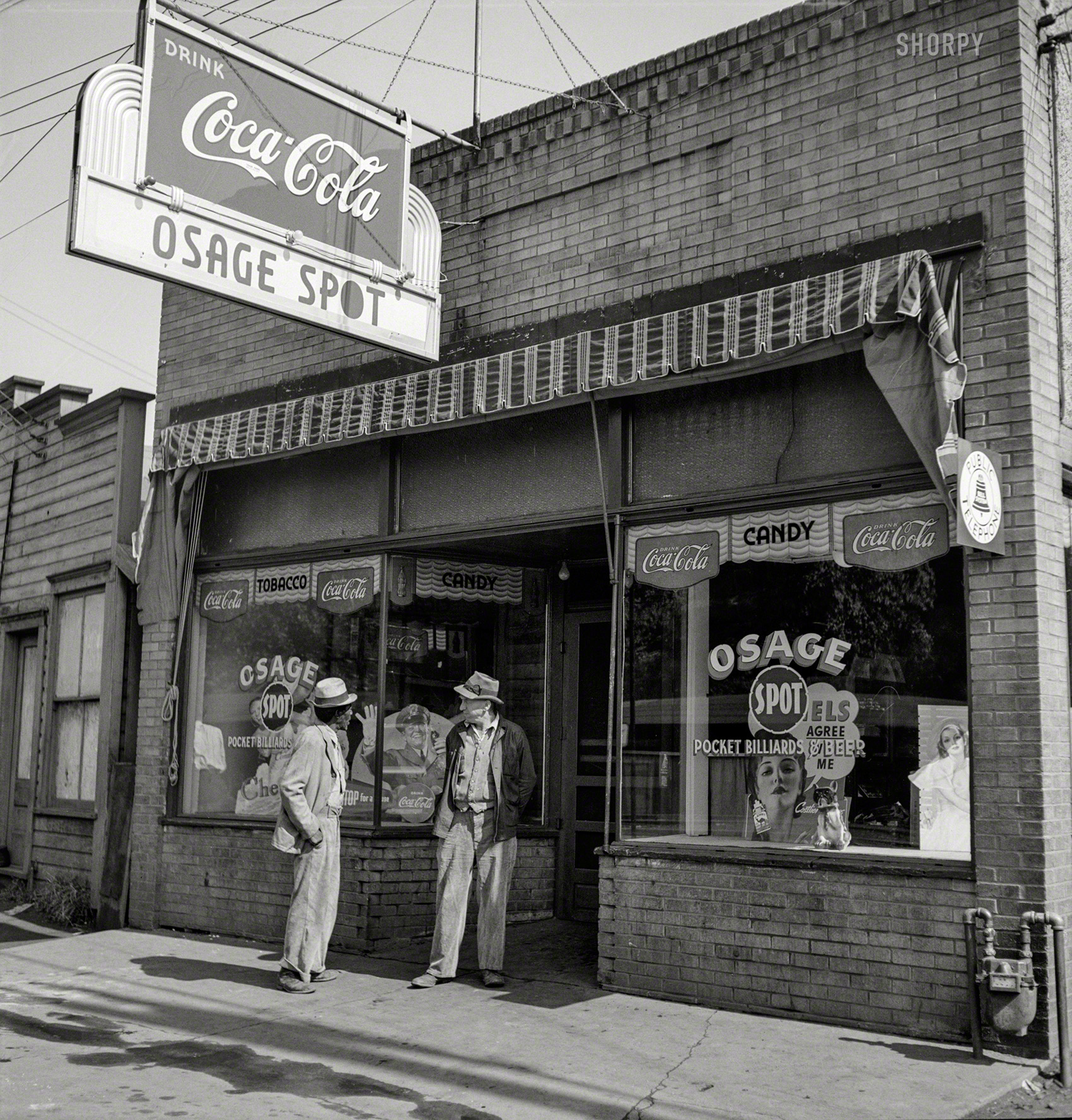 September 1938. "Storefront in mining town of Osage, West Virginia." Photo by Marion Post Wolcott for the Resettlement Administration. View full size.