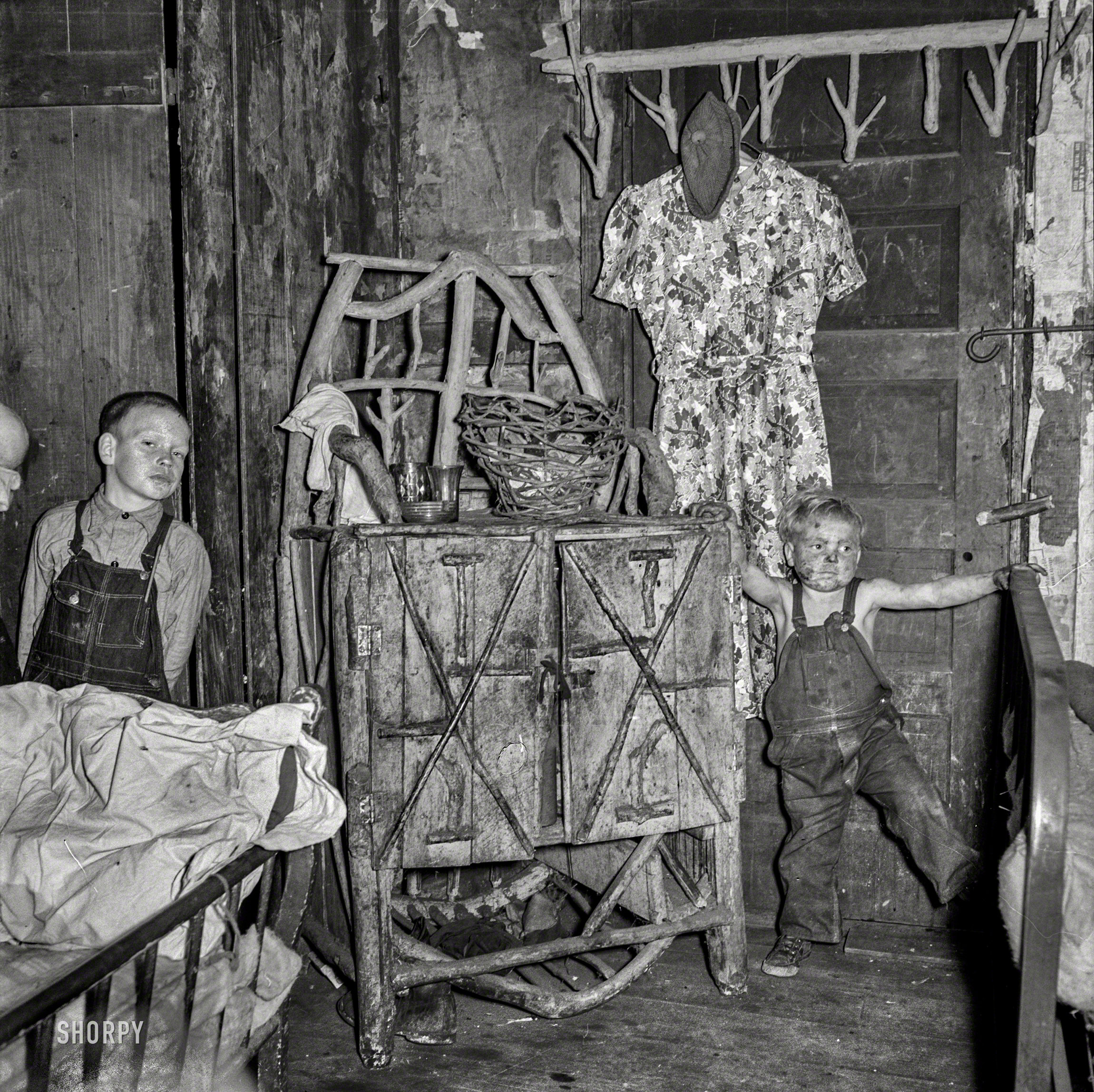 September 1938. "Homemade caned furniture in bedroom of coal miner's home. A company house. Pursglove, Scotts Run, West Virginia." Medium format negative by Marion Post Wolcott for the Resettlement Administration. View full size.