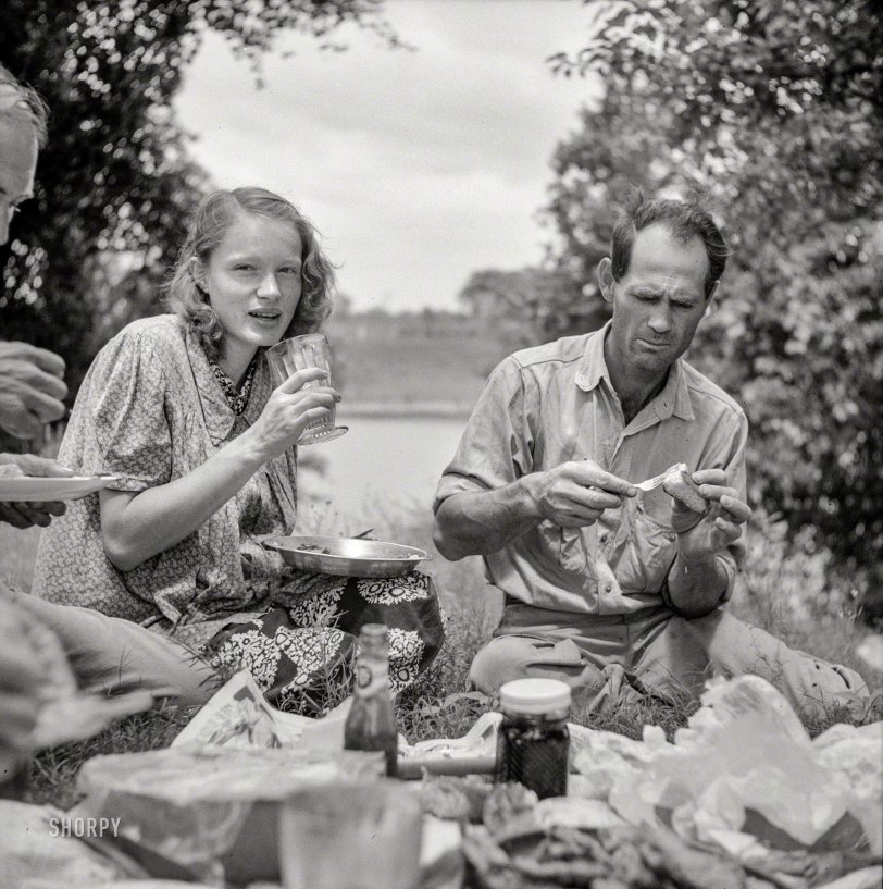 1940. "Farm family having Fourth of July fish fry along the Cane River near Natchitoches, Louisiana." Photo by Marion Post Wolcott. View full size.
