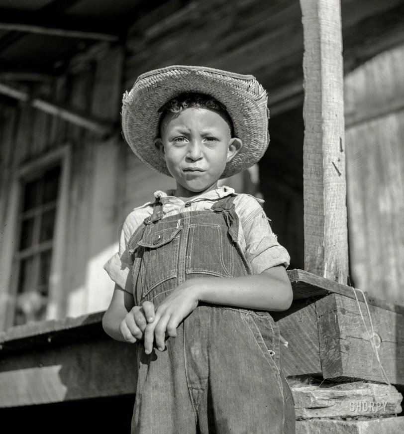 June 1940. "Melrose, Natchitoches Parish, Louisiana. Son of one of the mulattoes working on the John Henry plantation." Medium format nitrate negative by Marion Post Wolcott for the Resettlement Administration. View full size.
