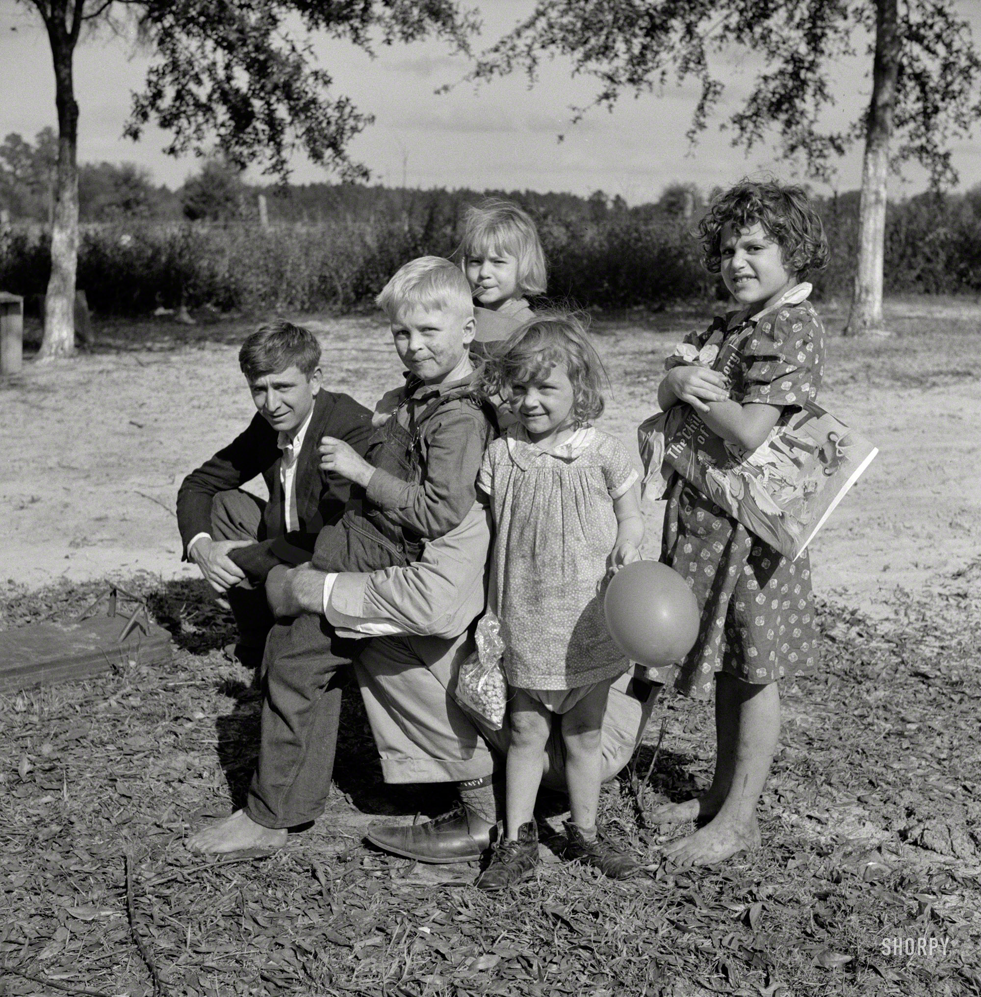 January 1941. "Starke, Florida. Family of construction worker who had been employed on Camp Blanding job." Medium format negative by Marion Post Wolcott for the Resettlement Administration. View full size.