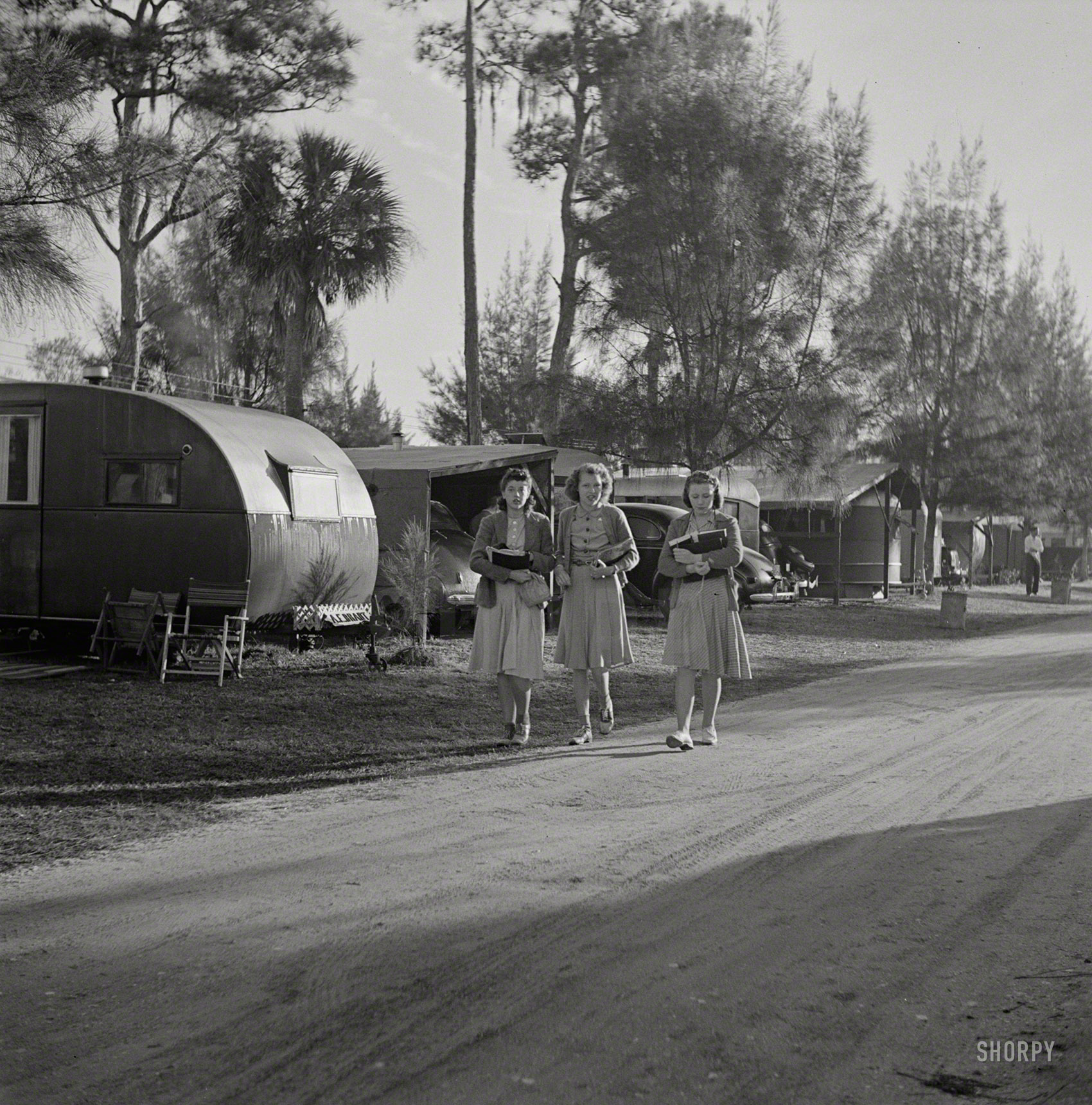 January 1941. "Sarasota, Florida, trailer park. Students coming from school in the afternoon." Medium format negative by Marion Post Wolcott. View full size.