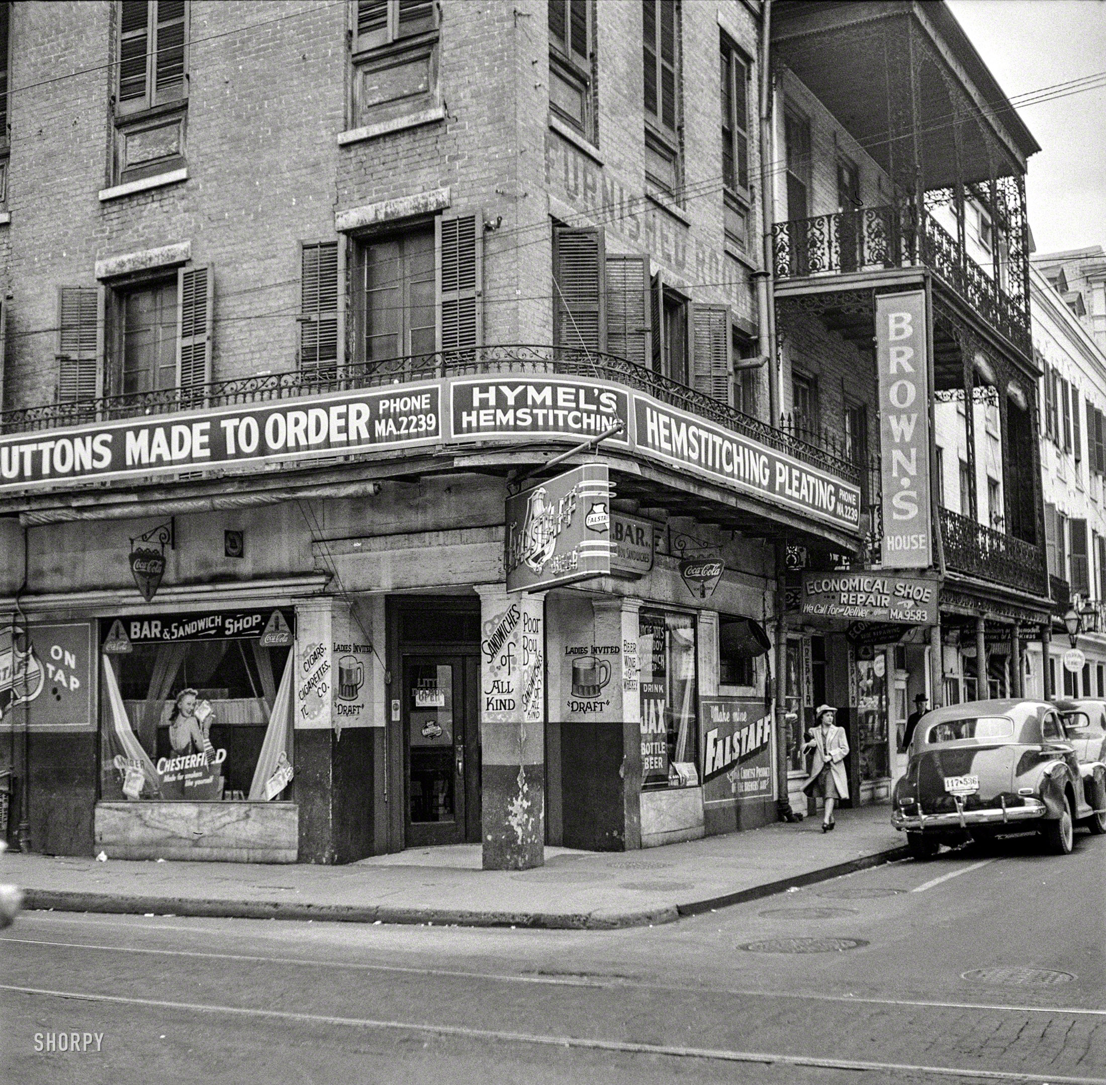 January 1941. "Old buildings in New Orleans." Custom Buttons and "Sandwiches of All Kind." Photo by Marion Post Wolcott. View full size.