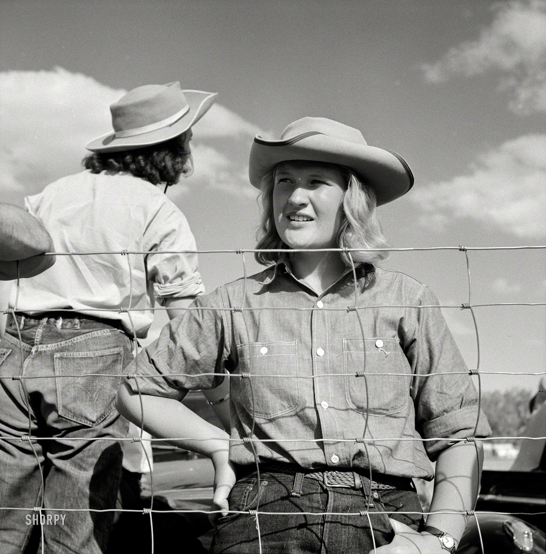 August 1941. "Dudes from Quarter Circle U Ranch at Crow Indian fair. Crow Agency, Big Horn County, Montana." Medium format negative by Marion Post Wolcott for the Farm Security Administration. View full size.