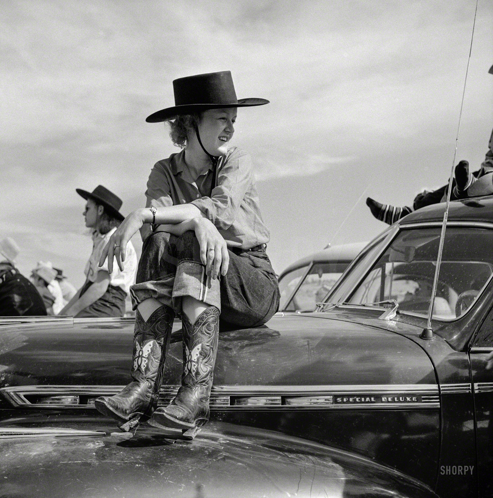 September 1941. "Dude at rodeo in Ashland, Montana." Whose ponies are all under the hood. Medium format negative by Marion Post Wolcott. View full size.