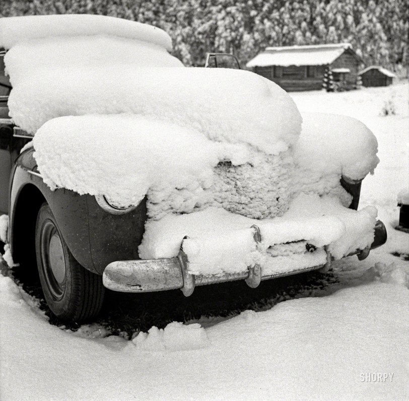 September 1941. "Car covered with snow after early fall blizzard on ranch in mountains near Aspen, Colorado." Medium format negative by Marion Post Wolcott for the Farm Security Administration. View full size.
