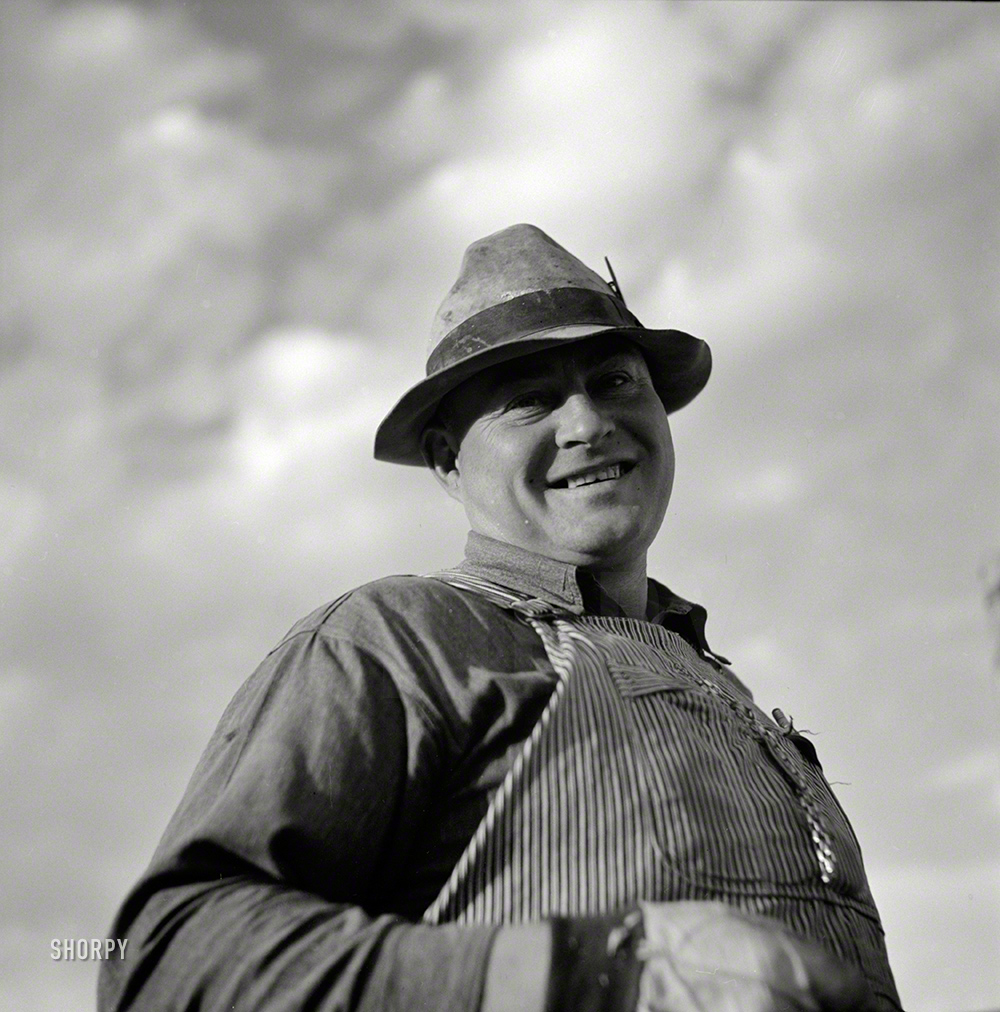 September 1941. "Frank E. Hagemeister, treasurer of the cooperative association on Scottsbluff Farmsteads, Farm Security Administration project. He has been here since 1937. He came from around Crawford, Nebraska, an extremely dry section with no irrigation." Photo by Marion Post Wolcott. View full size.
