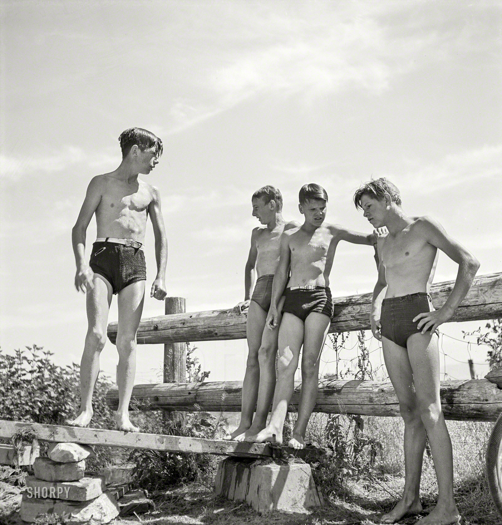 July 1942. "Rupert, Idaho. Schoolboys at swimming pool." Medium format negative by Russell Lee for the Office of War Information. View full size.