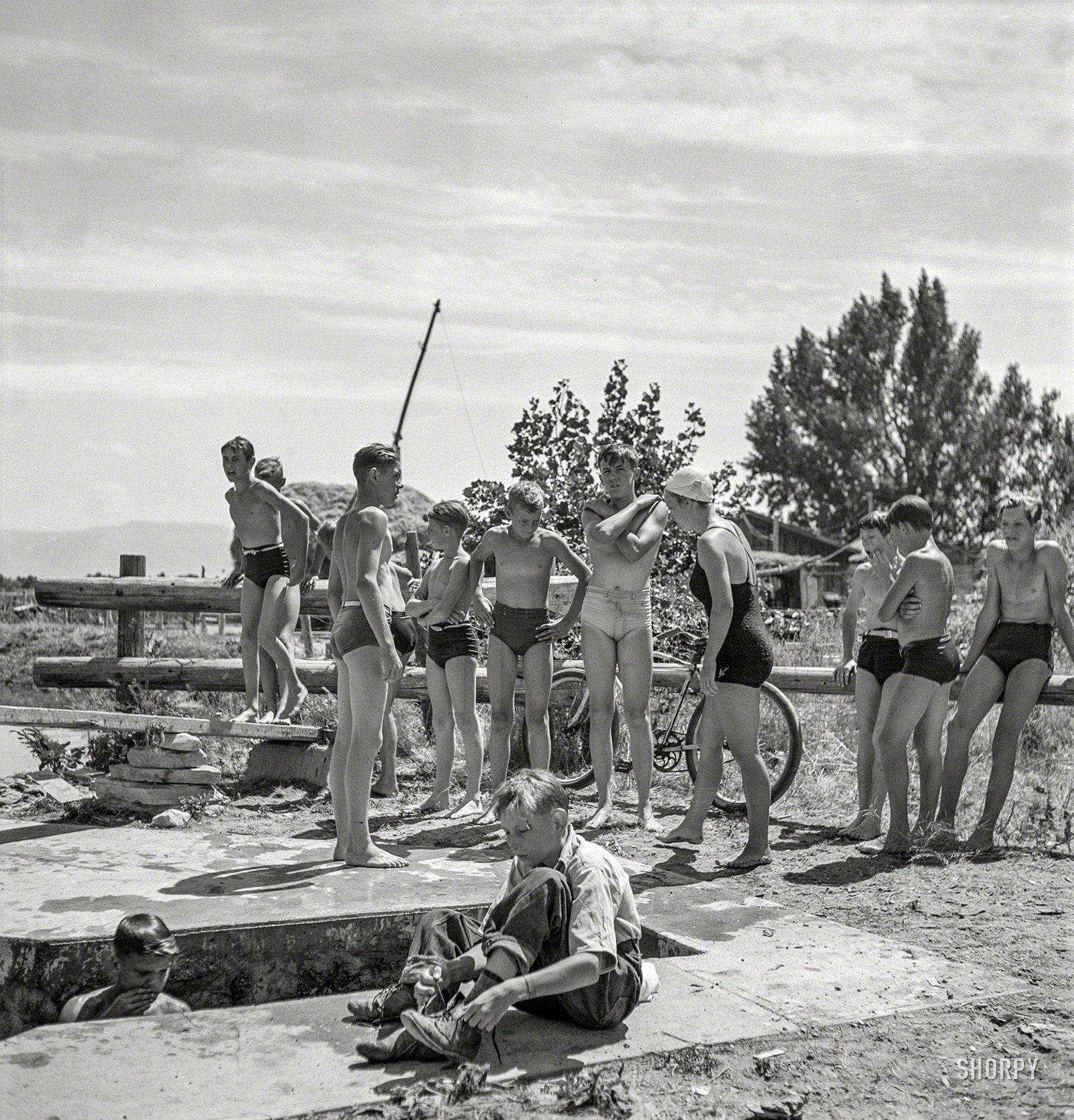 July 1942. "Rupert, Idaho. Dressing after swimming." Medium format negative by Russell Lee for the Office of War Information. View full size.