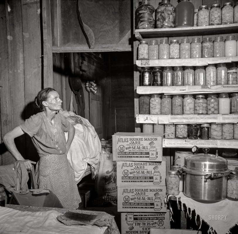 August 1941. Coffee County, Alabama. "Josh Smart family participates in the FSA Food for Defense program. Mrs. Eulia Smart says: 'I never had a pressure cooker before, an' when I got this one, I canned everything in sight' -- 264 quarts since spring." Medium format nitrate negative by John Collier for the Farm Security Administration. View full size.
