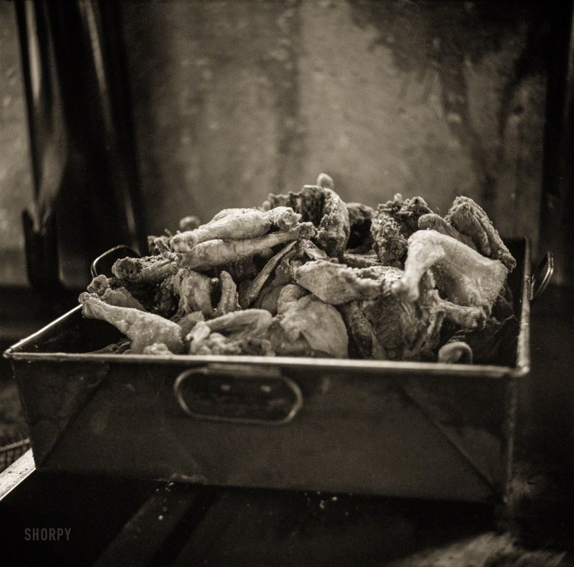 August 1941. "Feast of Farm Security Administration 'Food for Defense' chickens for the Craig Field flying cadets' Sunday dinner. Southeastern Air Training Center, Selma, Alabama." Medium format negative by John Collier. View full size.
