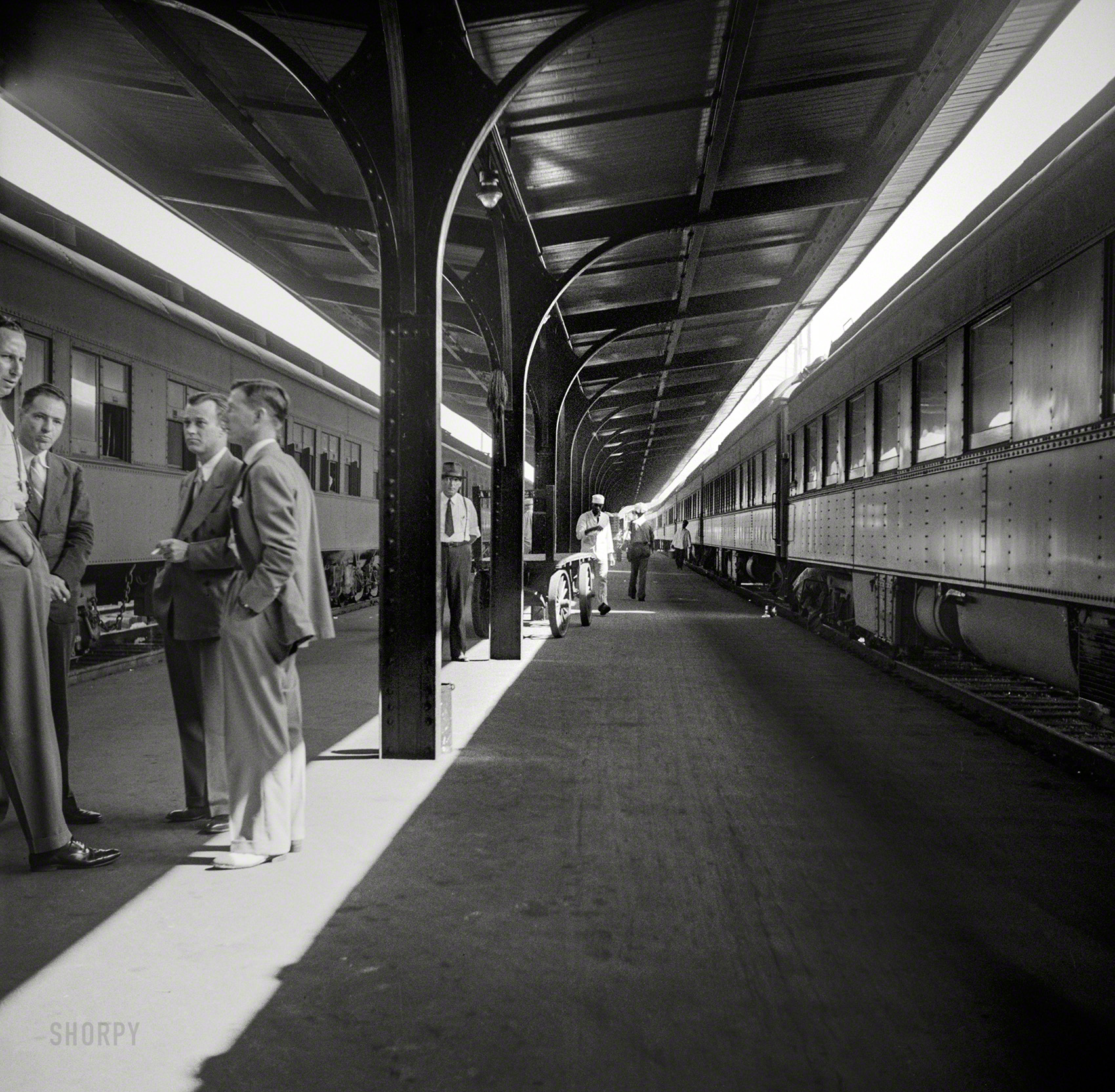 August 1941. "Trains in the Southern Railway terminal in Atlanta, Georgia." Medium format nitrate negative by John Collier. View full size.