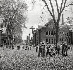October 1941. "Fall activities in Little Falls, N.Y." Where there's a nip in the air and the crisp crunch of freshmen underfoot. Photo by John Collier. View full size.